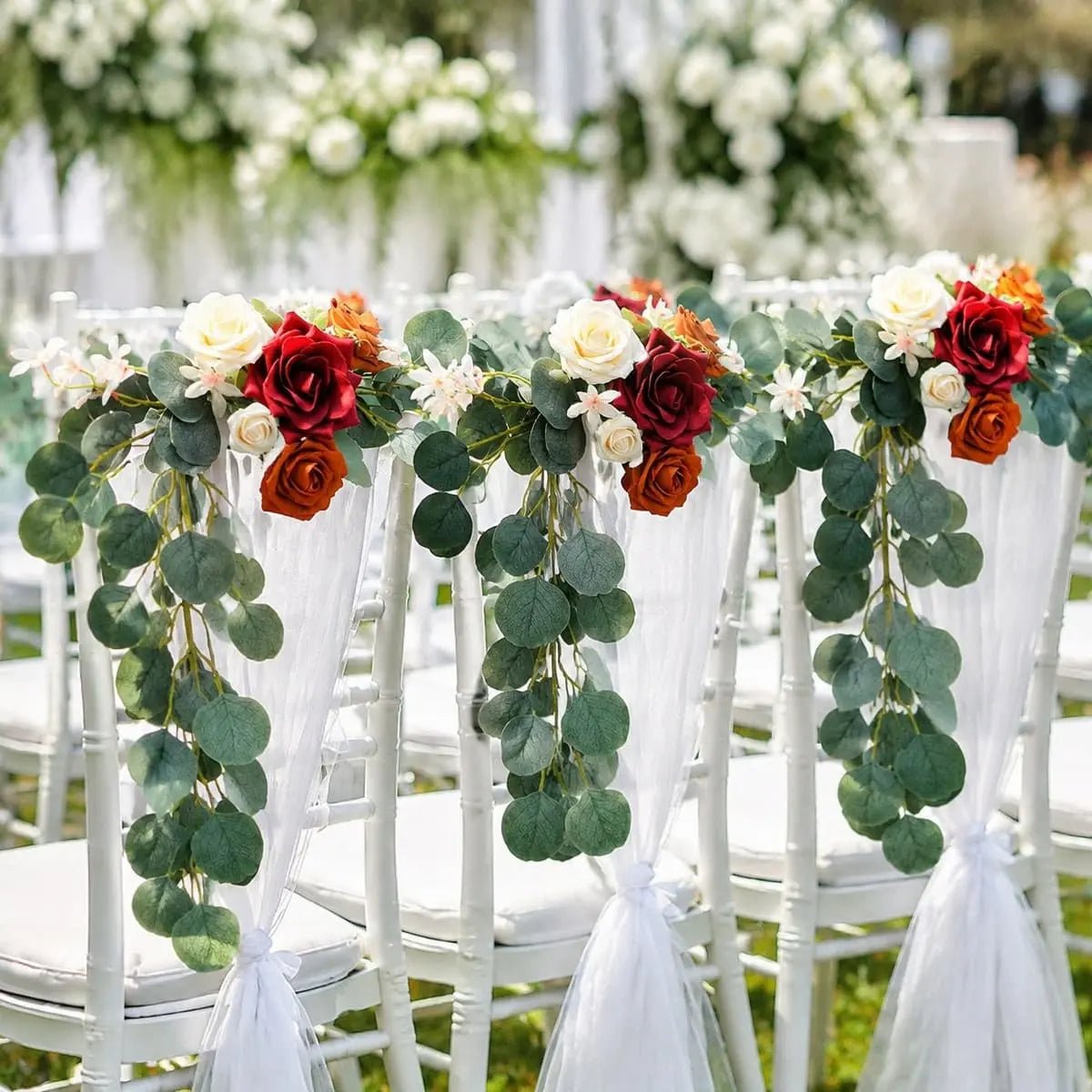 Artificial rose eucalyptus chair back garland on white Chiavari chairs at outdoor garden wedding ceremony – IPOPU
