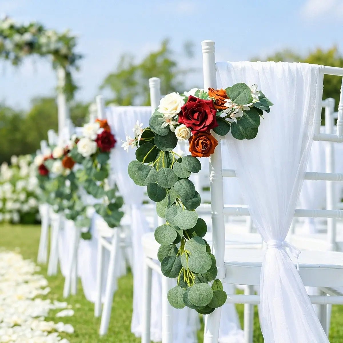 Burgundy terracotta rose silver dollar eucalyptus chair swag set of 2 on white Chiavari aisle chairs with long eucalyptus trail and white chiffon sash at outdoor garden wedding ceremony – IPOPU