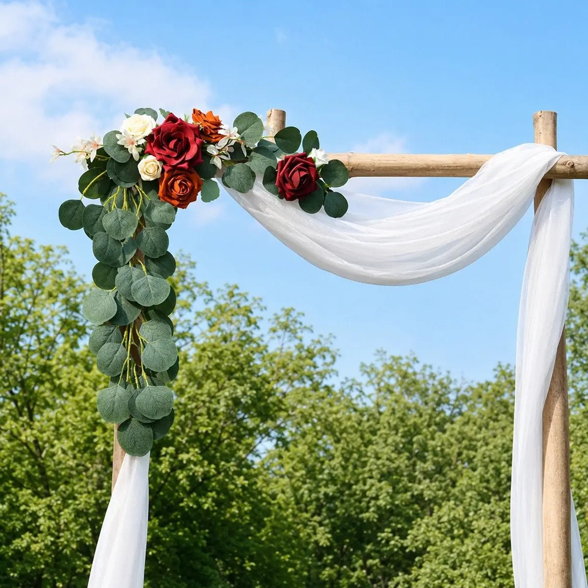 Burgundy terracotta rose silver dollar eucalyptus swag set of 2 attached to rustic wood square wedding arch top corner and side post with white chiffon drape at outdoor ceremony – IPOPU