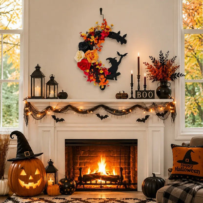 Crescent moon Halloween wreath styled on a fireplace mantel with candles and autumn seasonal decor