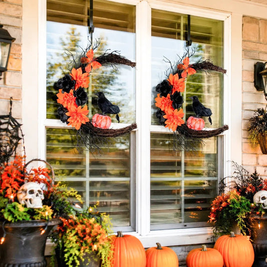 Crescent moon Halloween wreath with black crow and orange flowers displayed on a white window frame