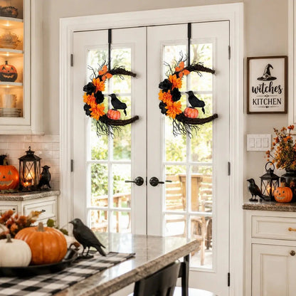 Crescent moon Halloween wreath on a white front door with pumpkins on porch steps