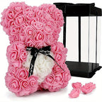 Dark pink rose teddy bear with black ribbon in colorblock gift box
