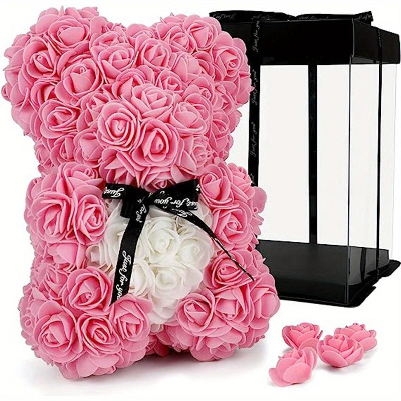 Dark pink rose teddy bear with black ribbon in colorblock gift box
