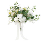 White artificial wedding bouquet held by bride – rustic farmhouse ceremony
