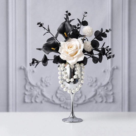 White rose and black calla lily gothic artificial flower arrangement in silver goblet vase on a white background product shot
