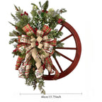 Green farmhouse wagon wheel Christmas wreath with ribbon bow berry accents front door decor
