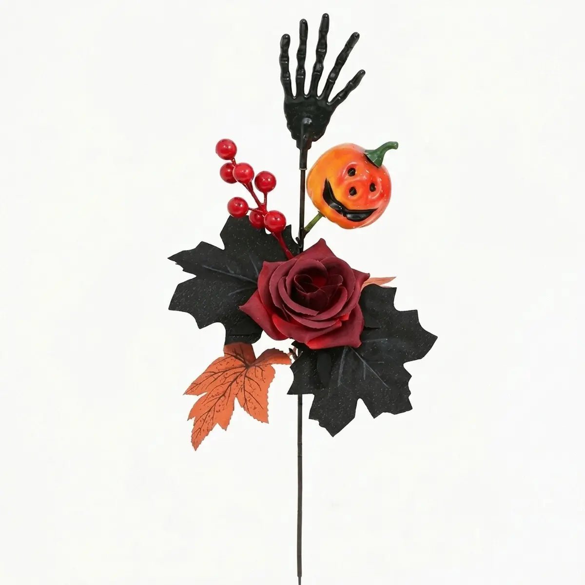 Halloween skeleton hand flower stem with pumpkin ghost face and dark floral arrangement