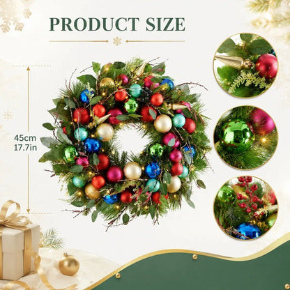 Christmas wreath product size chart showing 45cm (17.7 inch) diameter, with three close-up detail callouts: gold tassel cone pendant with gold snowflake pick on pine and eucalyptus base, shiny green and hot pink ball ornaments on pine branch, and red berry cluster with blue ball ornament and gold snowflake pick on twig base with warm LED fairy lights
