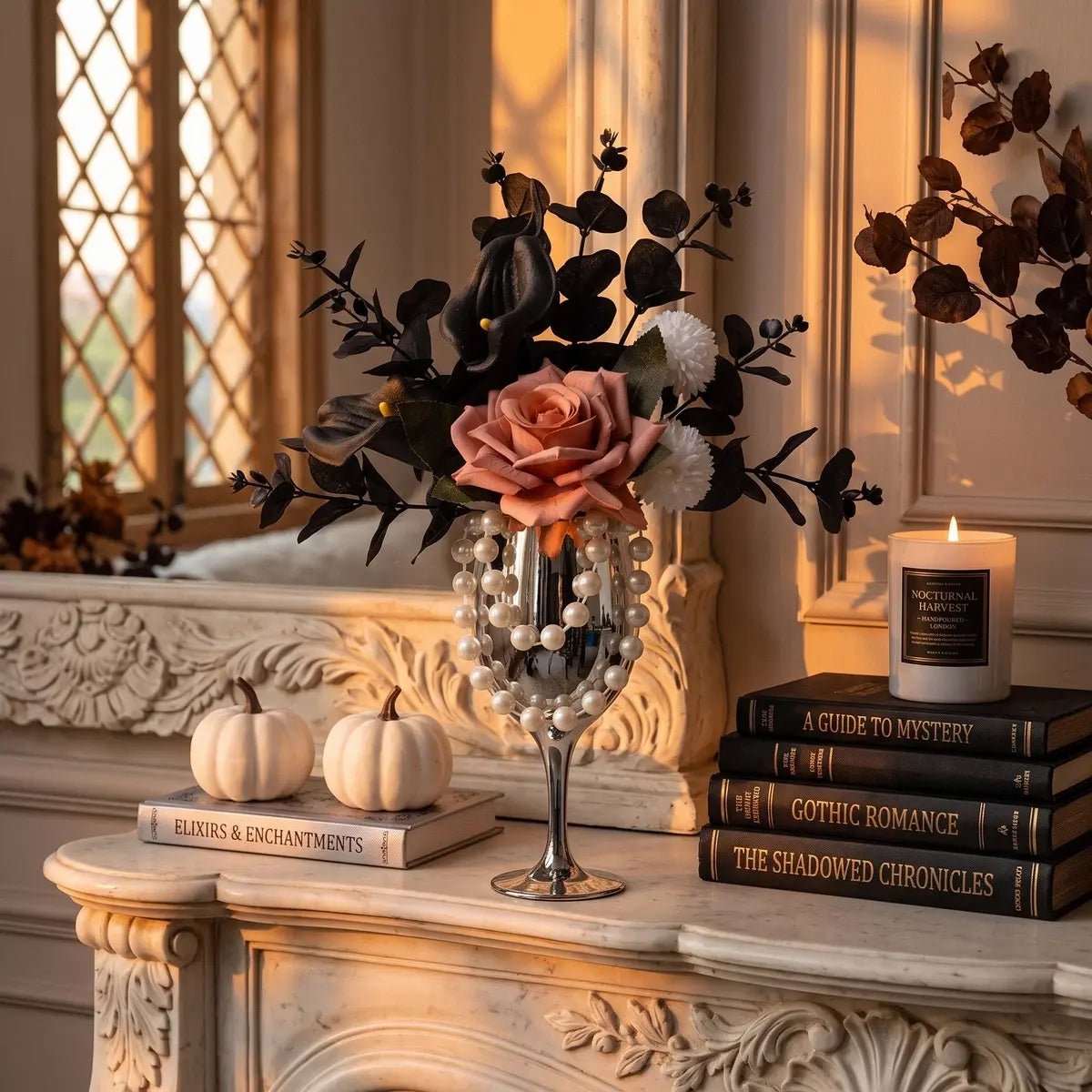 Gothic artificial flower arrangement in silver goblet vase displayed in a dark moody room with candles and Halloween decor