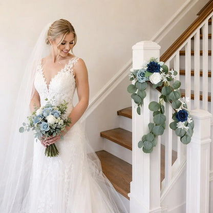 Navy blue dusty blue rose silver dollar eucalyptus swag set of 2 attached to white indoor staircase newel post with bride in lace wedding gown holding floral bouquet – IPOPU