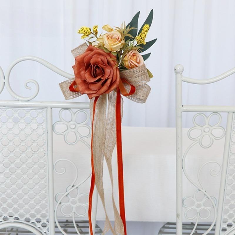 Orange artificial flower pew decoration with eucalyptus and ribbon wedding aisle decor