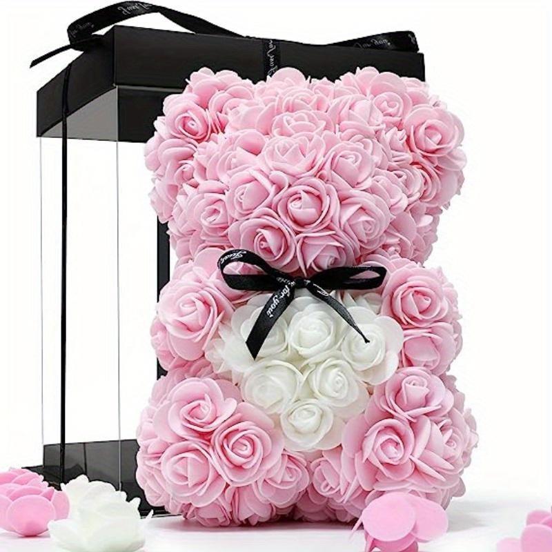 Pink rose teddy bear with black ribbon in colorblock gift box
