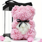 Pink rose teddy bear with black ribbon in colorblock gift box
