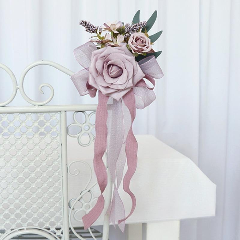 Pink artificial flower pew decoration with eucalyptus and ribbon wedding aisle decor