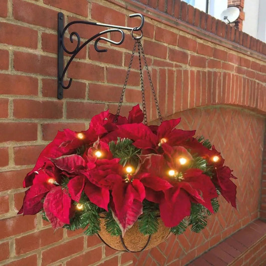 Pre-Lit Artificial Christmas Poinsettia Hanging Basket with LED Lights Mounted on Brick Wall

