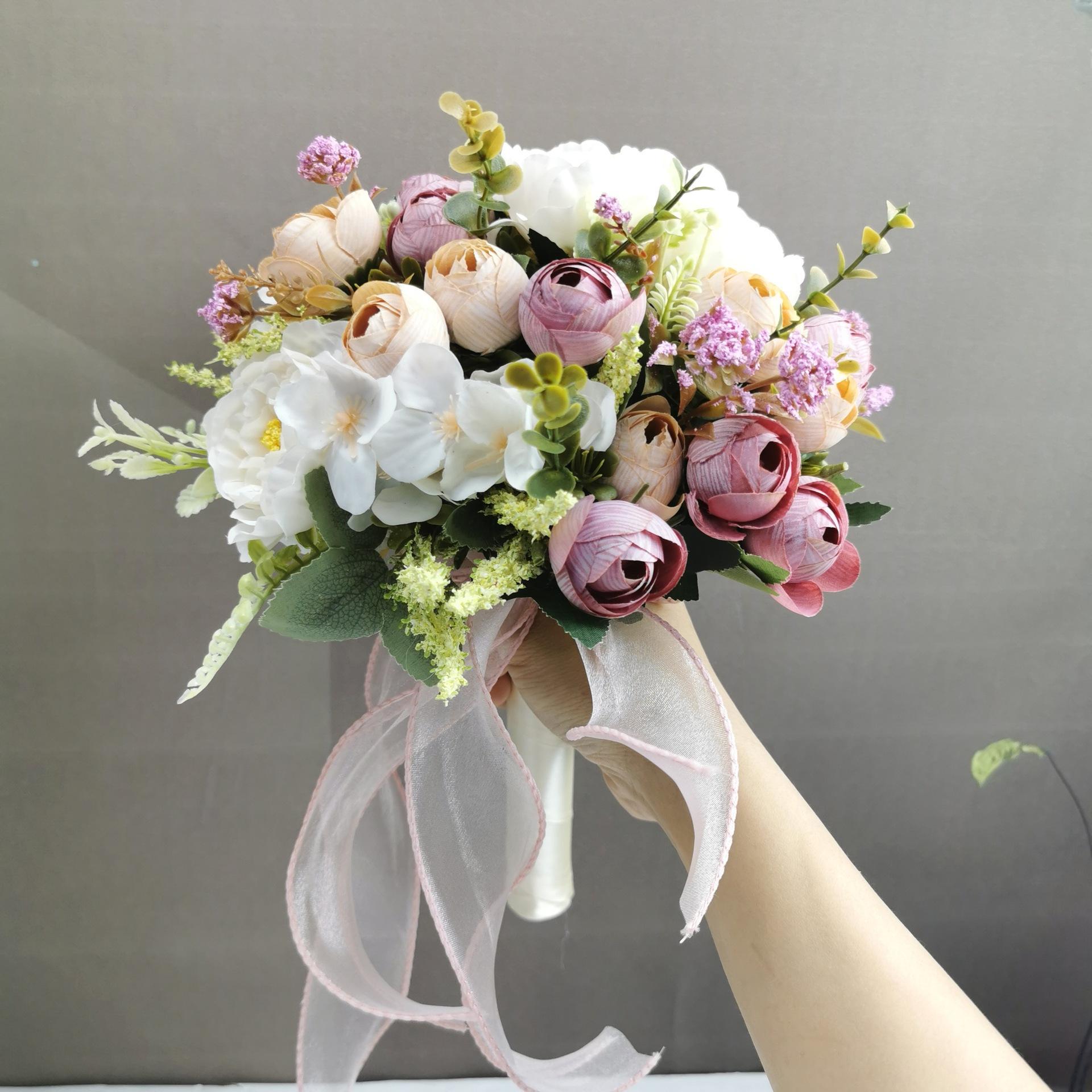 Purple artificial wedding bouquet with roses hydrangeas and camellias for bride