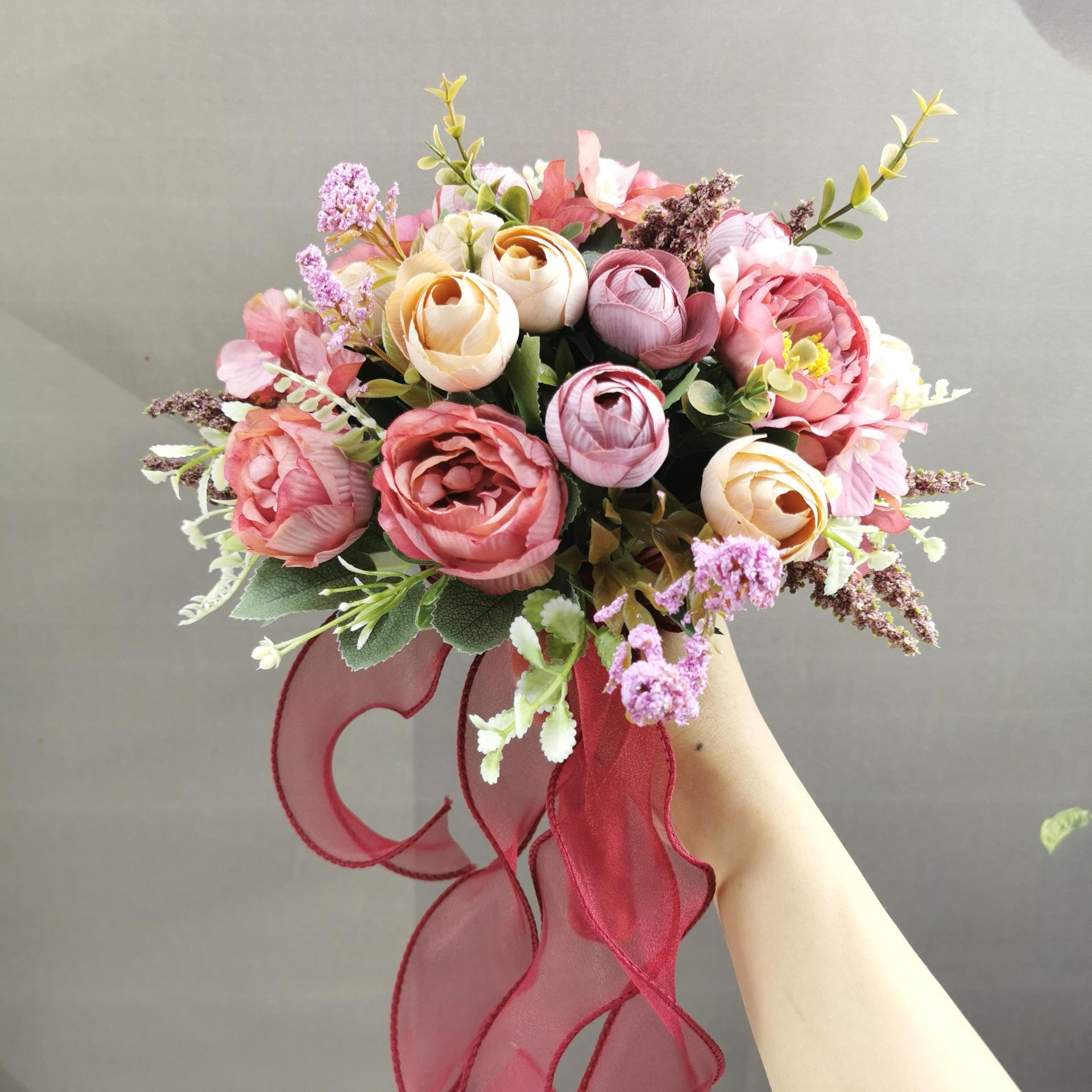 Red artificial bridal bouquet with roses hydrangeas and camellias for wedding