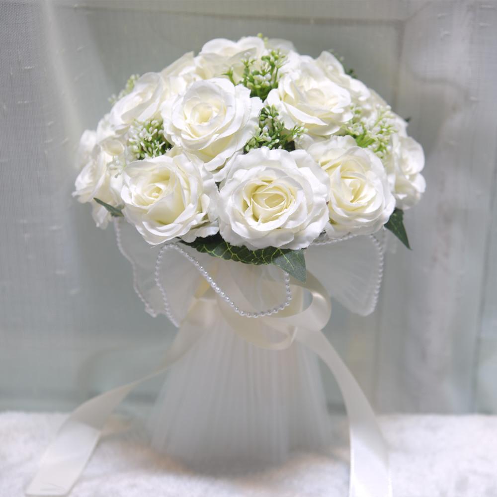 White artificial rose bridal bouquet for wedding ceremony and bridesmaid