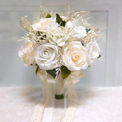 White artificial rose bridal bouquet French vintage boho rustic style for wedding ceremony
